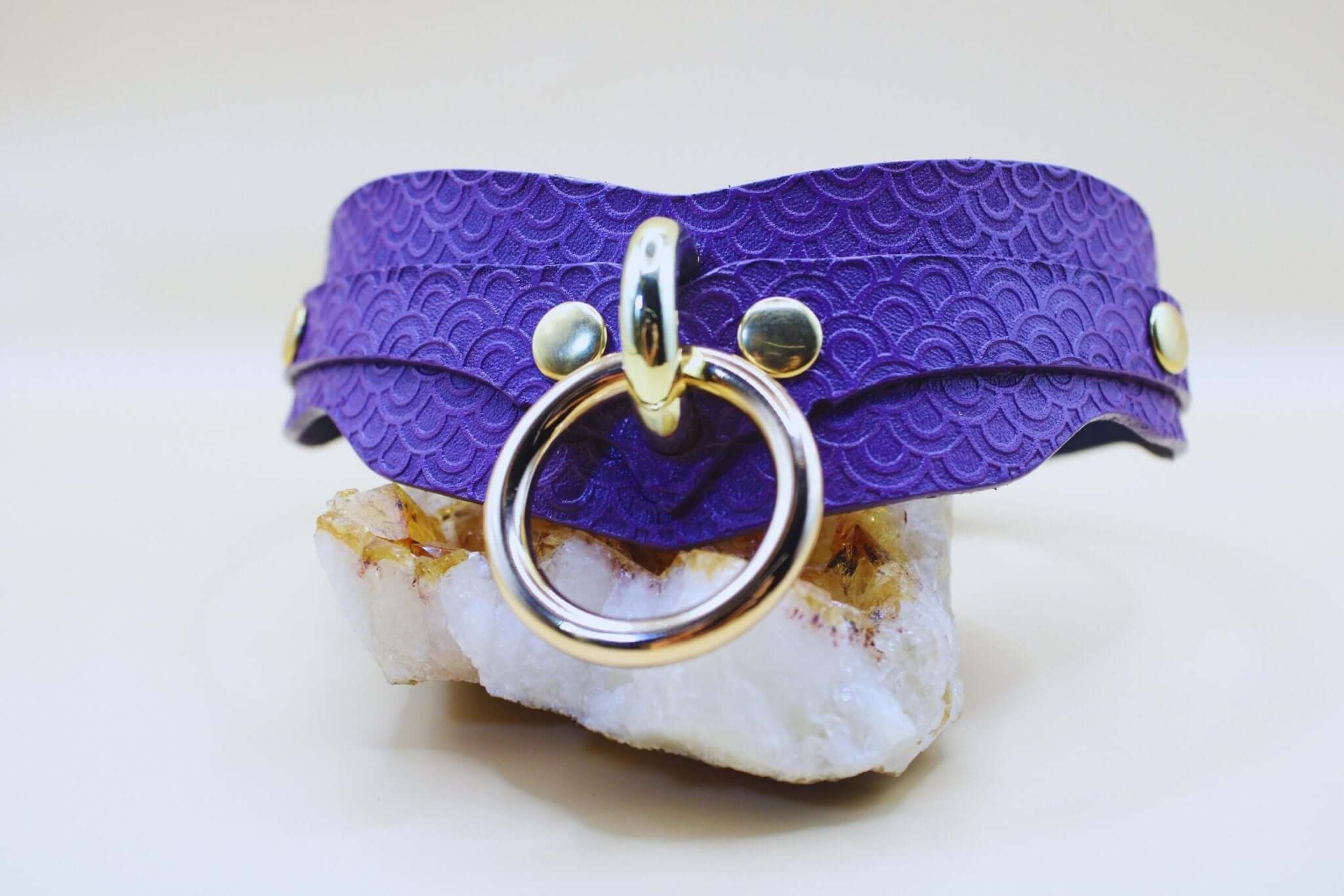 Elegant purple BDSM collar with embossed scale pattern and D-ring, perfect for submissive jewelry and playtime.