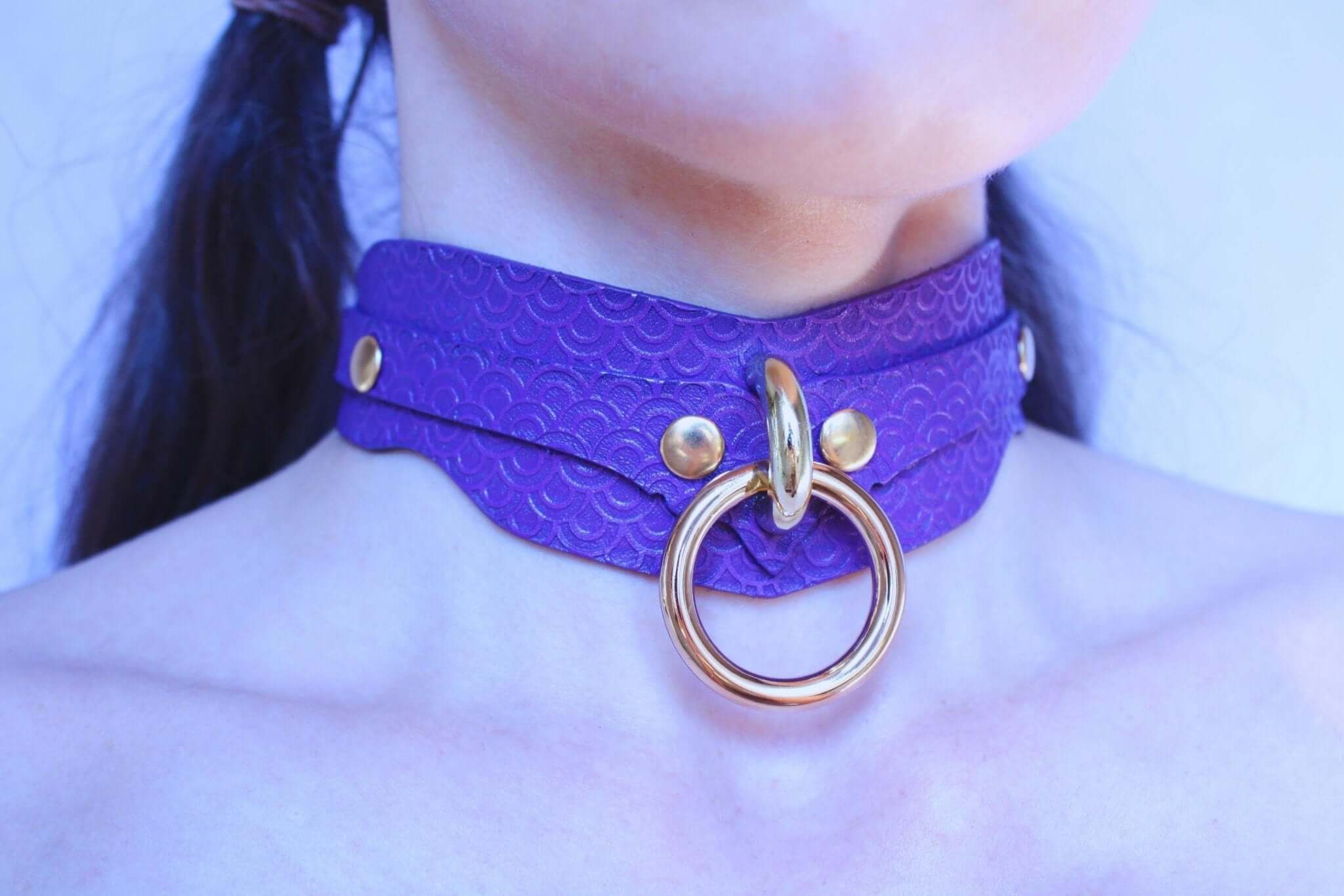Elegant purple BDSM collar with D-ring, perfect for submissive jewelry and playful power exchange.