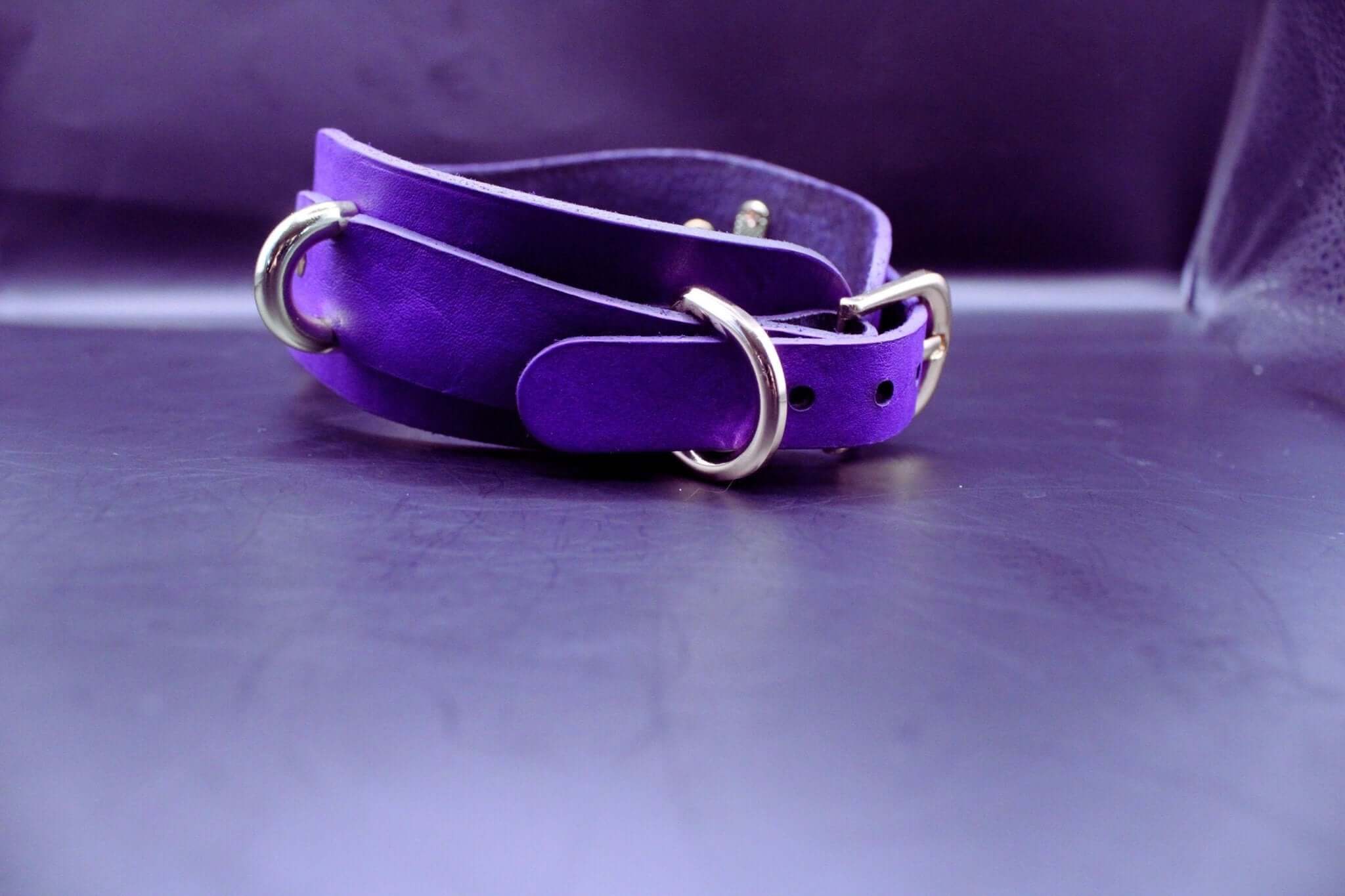 Purple posture collar with gold hardware, perfect for BDSM and submissive jewelry, ideal for D/s lifestyle and bondage gear.