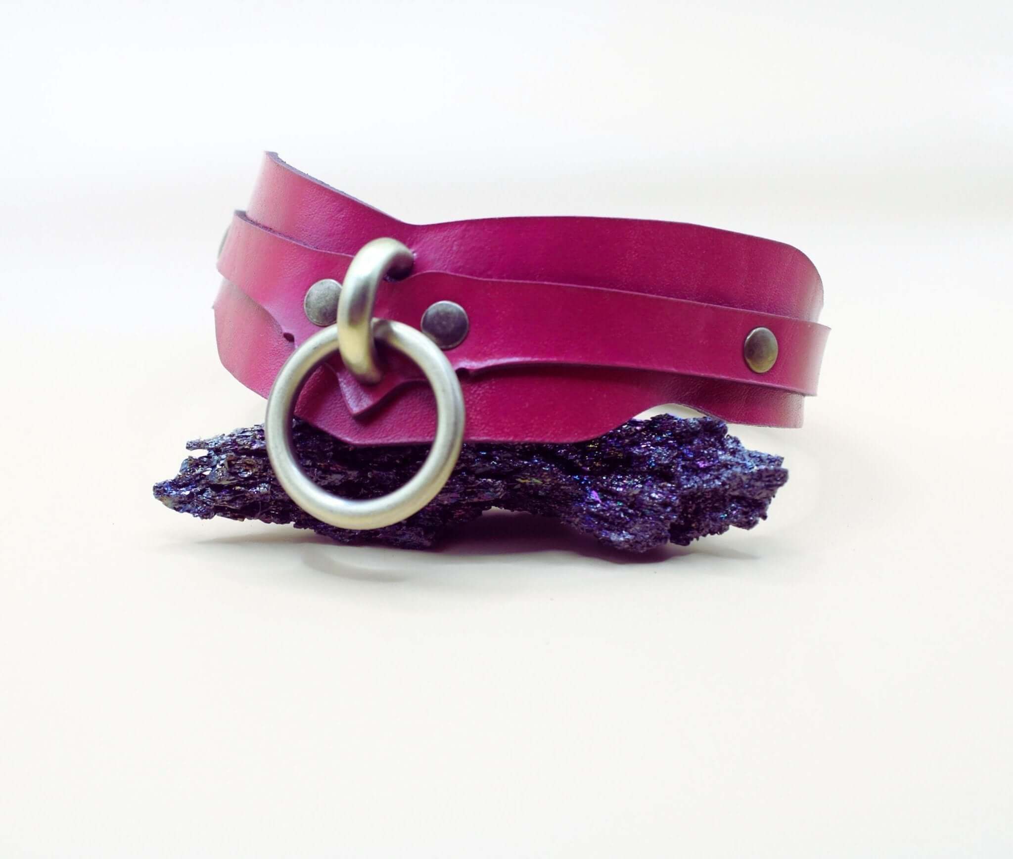 Raspberry leather BDSM collar with O-ring, ideal submissive jewelry for bondage enthusiasts.