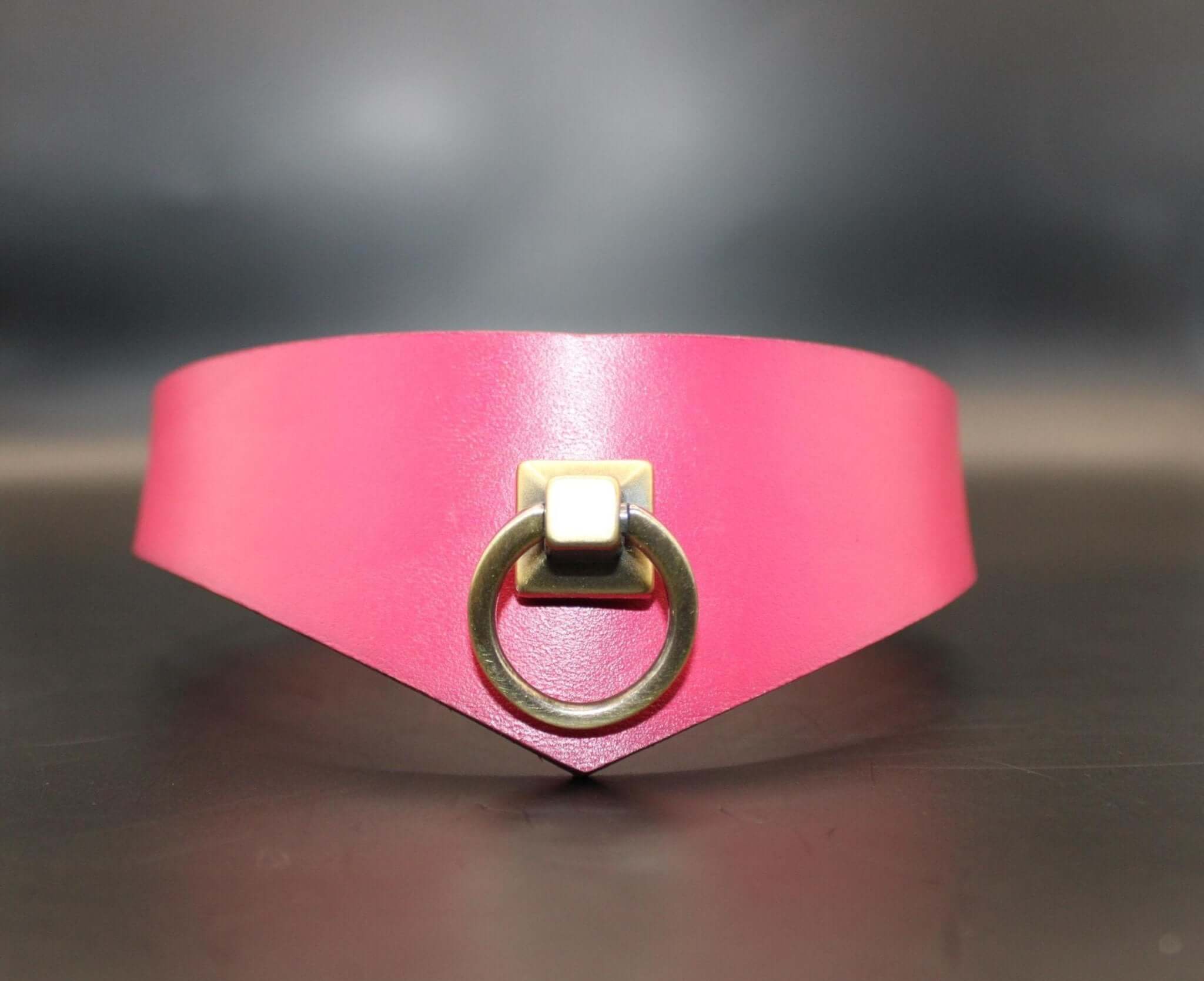 Raspberry leather submissive collar with D-ring, perfect for BDSM play and elegant bondage jewelry.