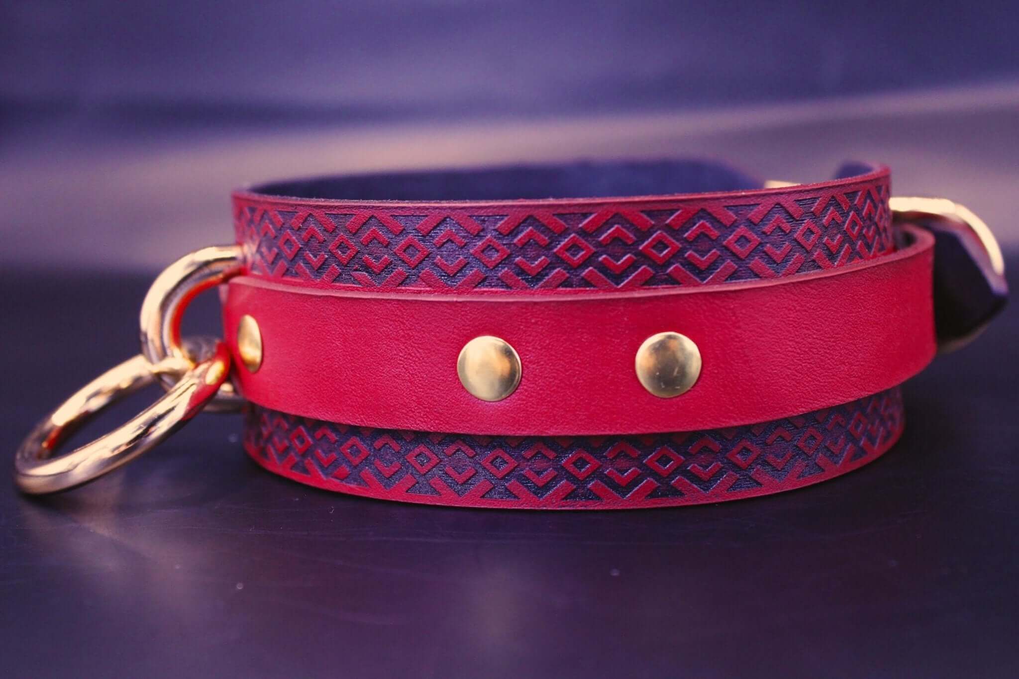 Red BDSM collar with tribal pattern, handcrafted leather, perfect for submissive jewelry and dominance play.