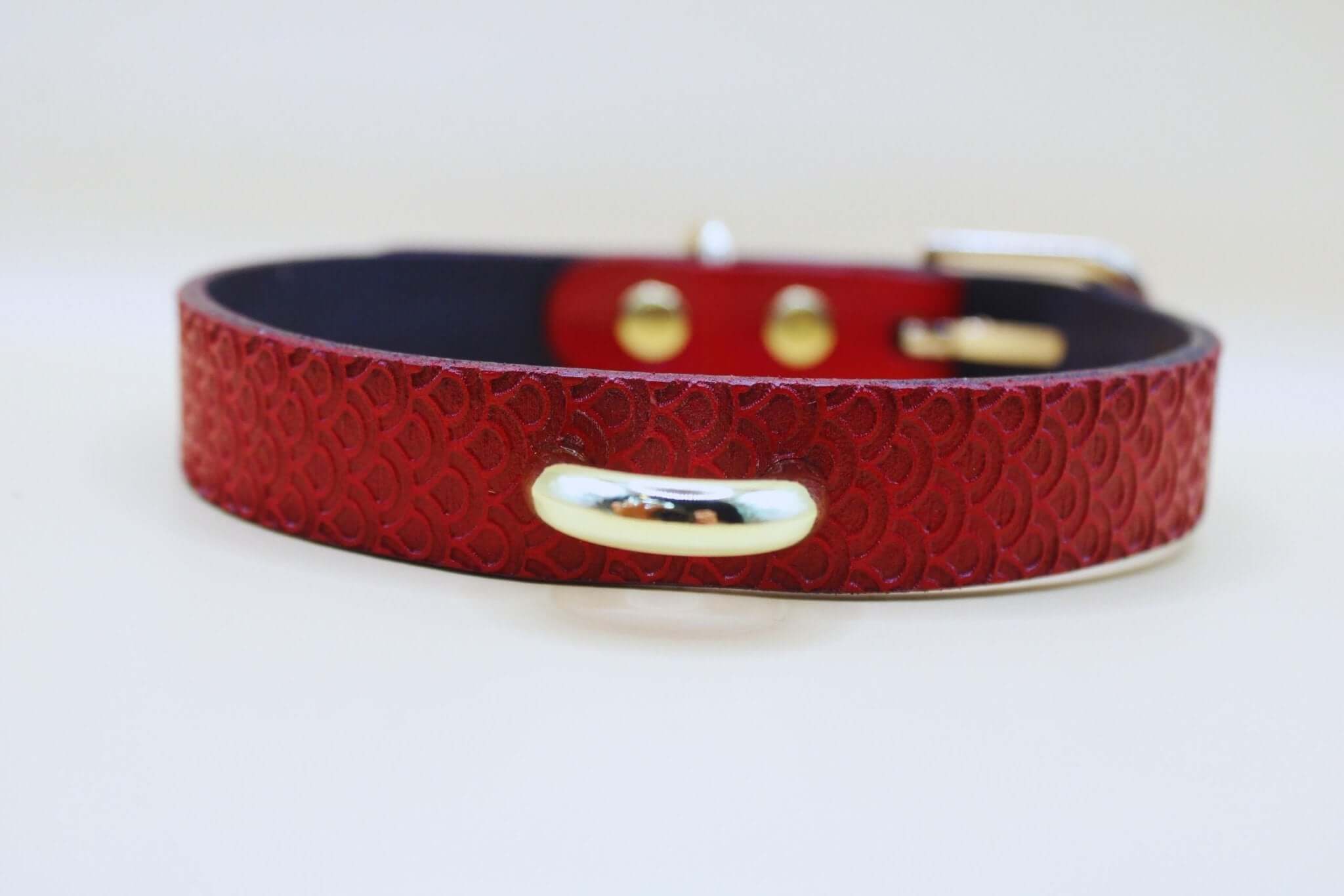 Elegant red leather BDSM collar with a shiny buckle, perfect for submissive jewelry and discreet day wear.
