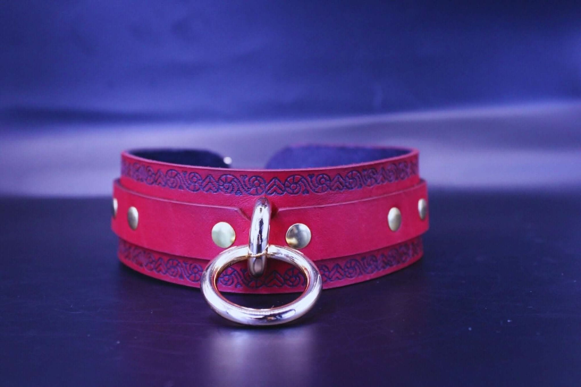 Red leather bdsm collar with O-ring, perfect for submissive jewelry and bondage gear.