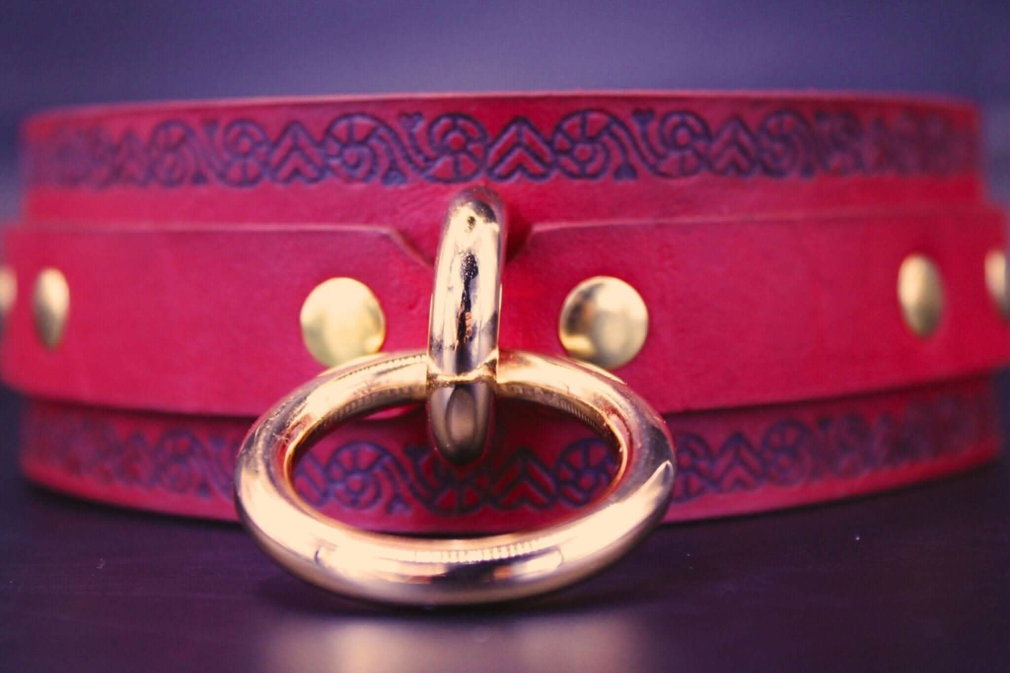 Red leather submissive collar with O-ring and gold hardware, perfect for BDSM and bondage lovers.
