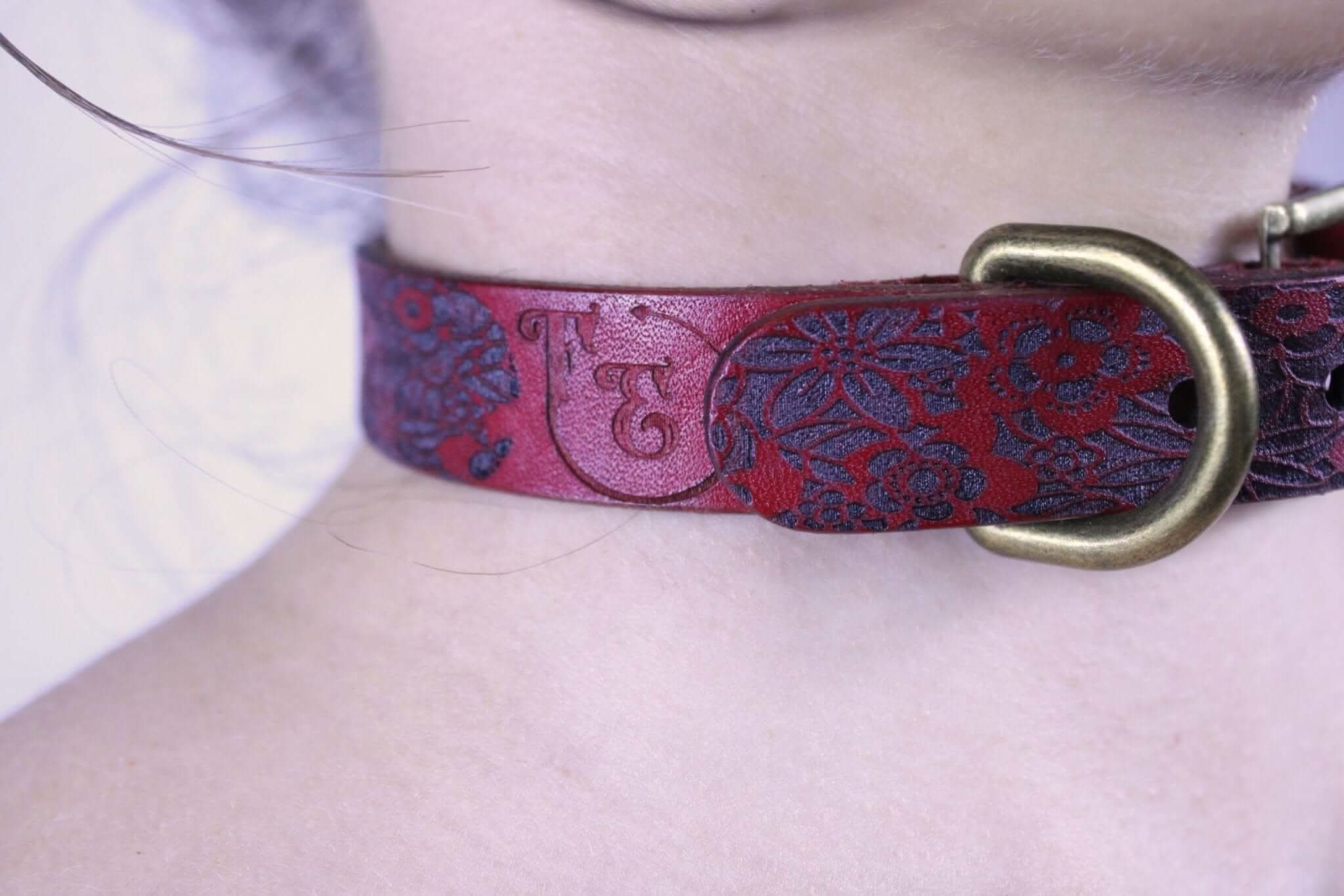 Handcrafted dark red floral sub collar made of leather, designed for submissive jewelry and BDSM enthusiasts.