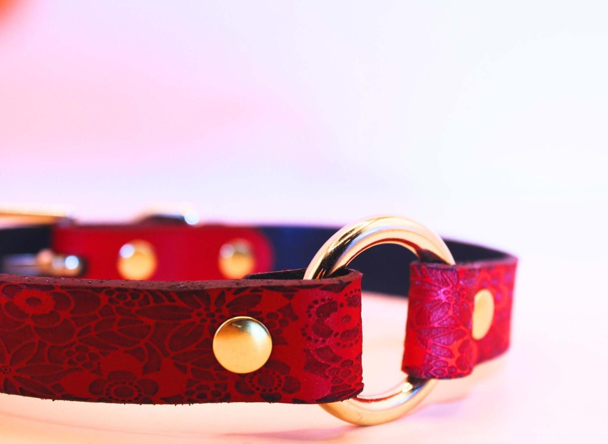 Elegant red floral leather submissive collar with gold O-ring, perfect for BDSM jewelry and sub collar discreet wear.