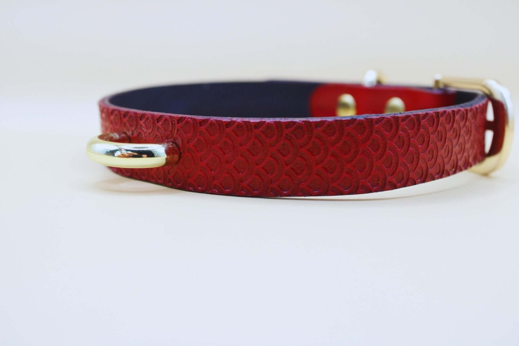 Elegant red leather submissive collar with gold hardware for BDSM and bondage style.