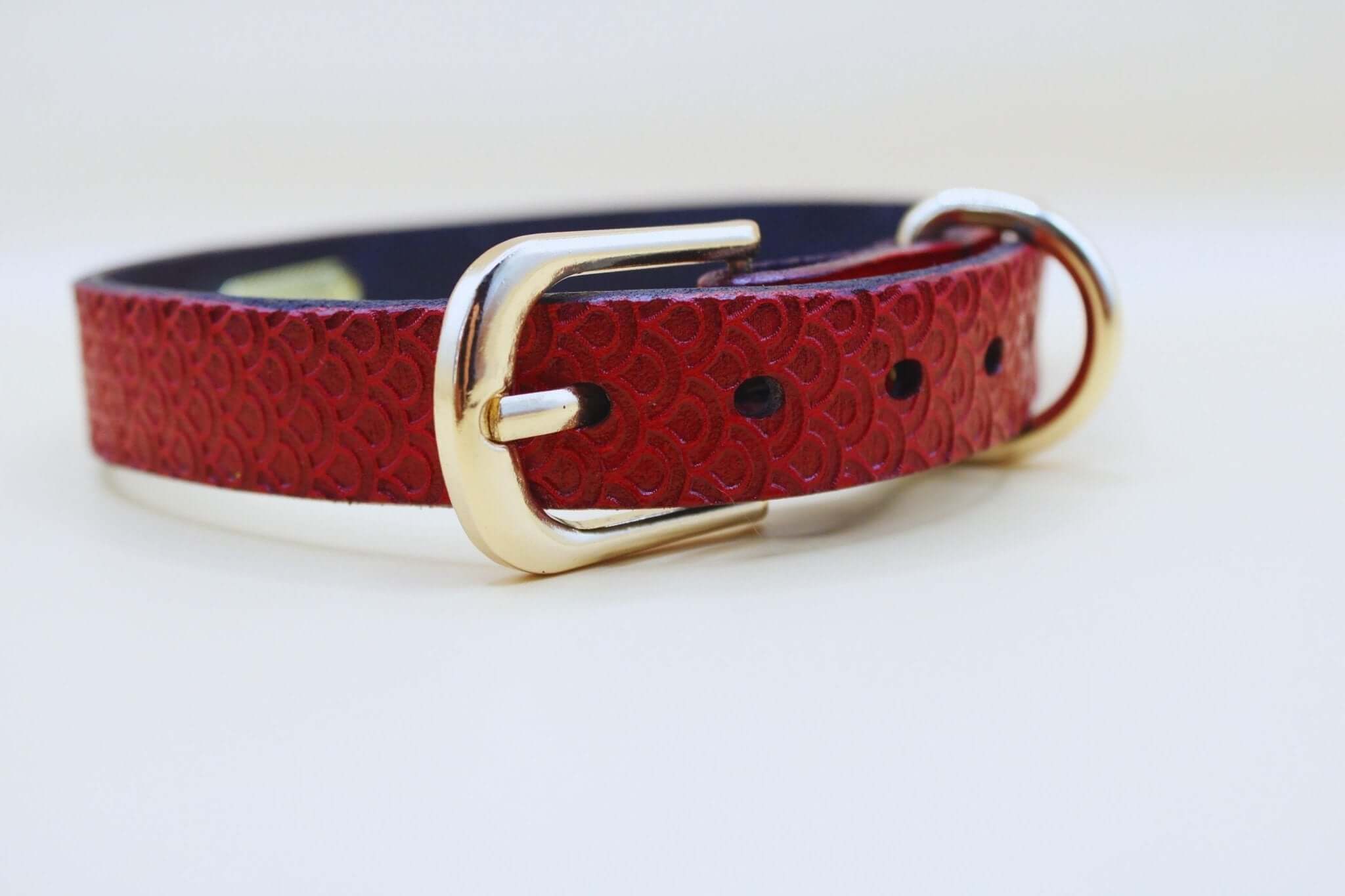 Red leather BDSM collar with gold buckle, perfect for submissive jewelry and bondage gear.