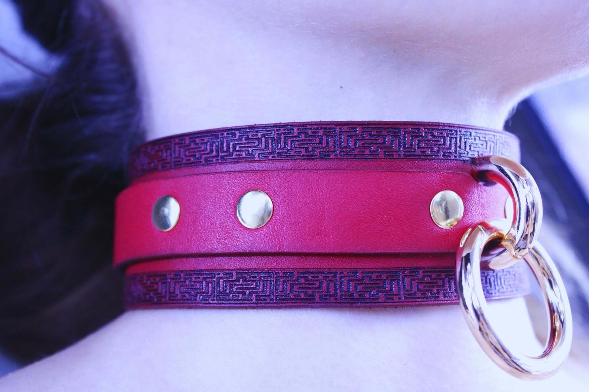 Handmade red leather choker collar with gold accents, ideal for bdsm and discreet day collar styling.