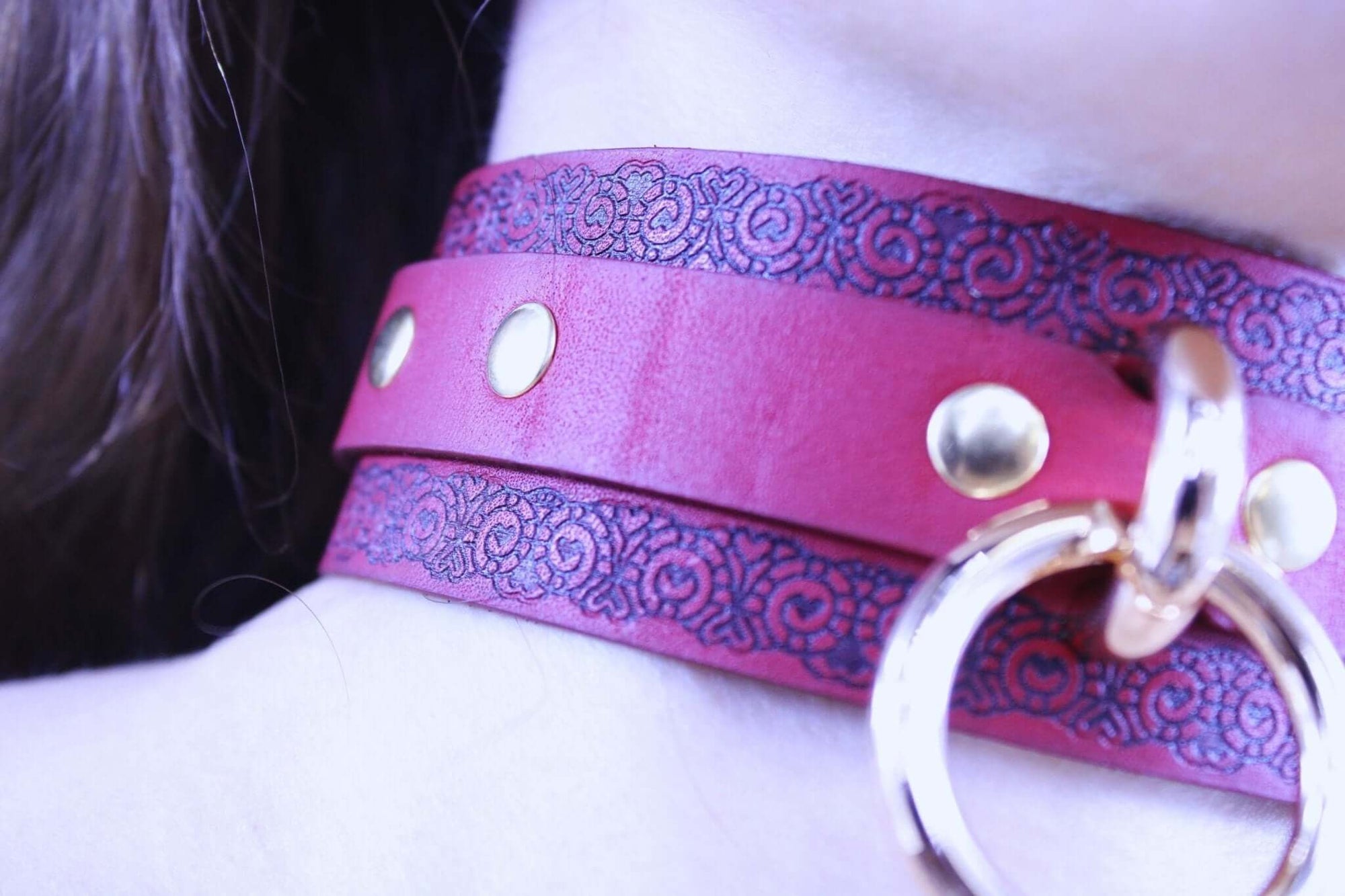 Red submissive collar with gothic pattern, gold studs, and metal ring, perfect for BDSM and bondage aesthetics.