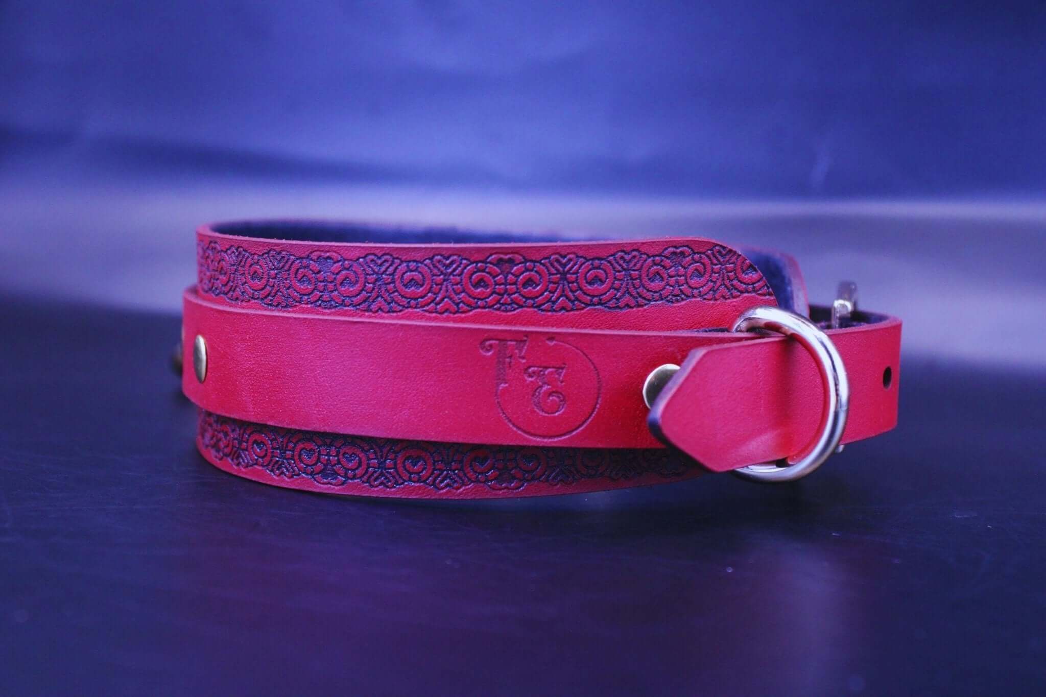 Red ornamental submissive collar with gothic pattern, perfect for bdsm lovers and discreet day collar fashion.