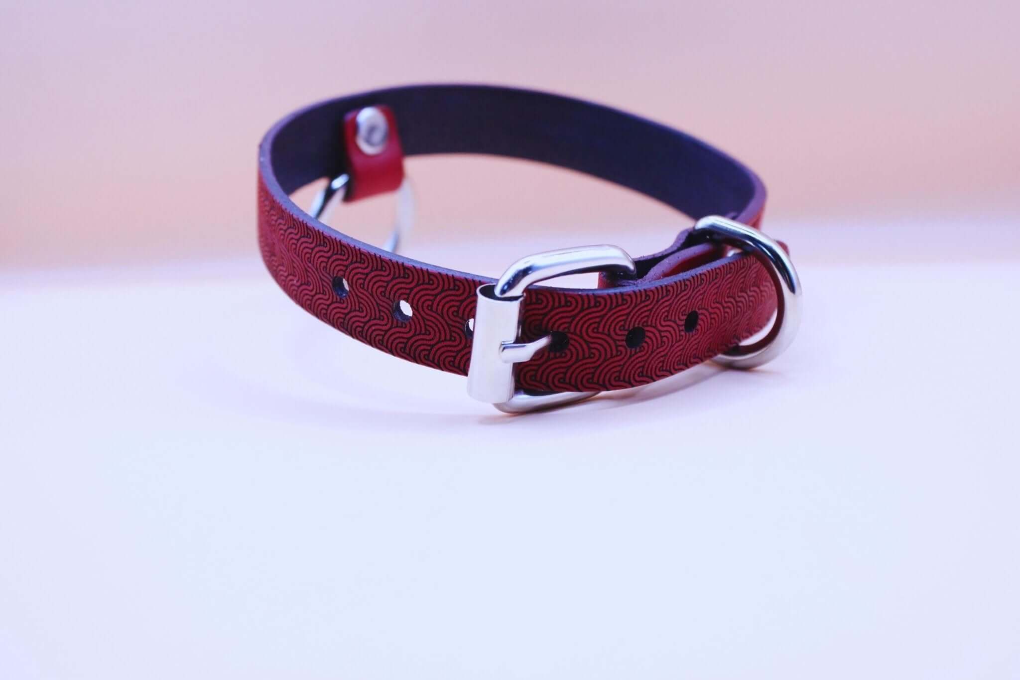 Red patterned leather submissive collar with O-ring, perfect for BDSM day wear and bondage gear.