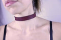 Elegant red patterned submissive collar, perfect for day wear and BDSM aesthetics, handcrafted from durable leather.