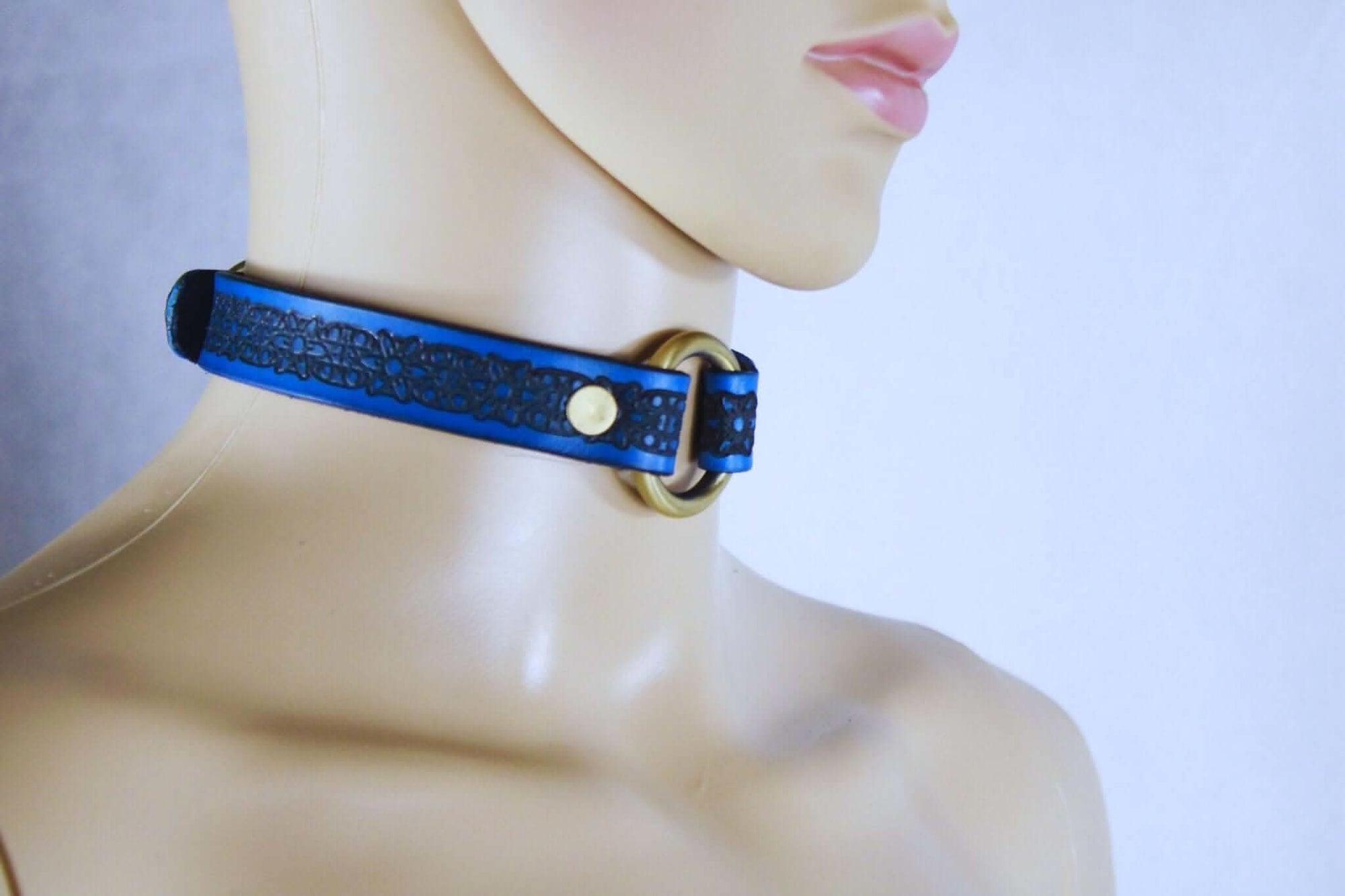 Royal blue submissive collar with floral pattern, elegant BDSM day collar for discreet wear and power exchange.