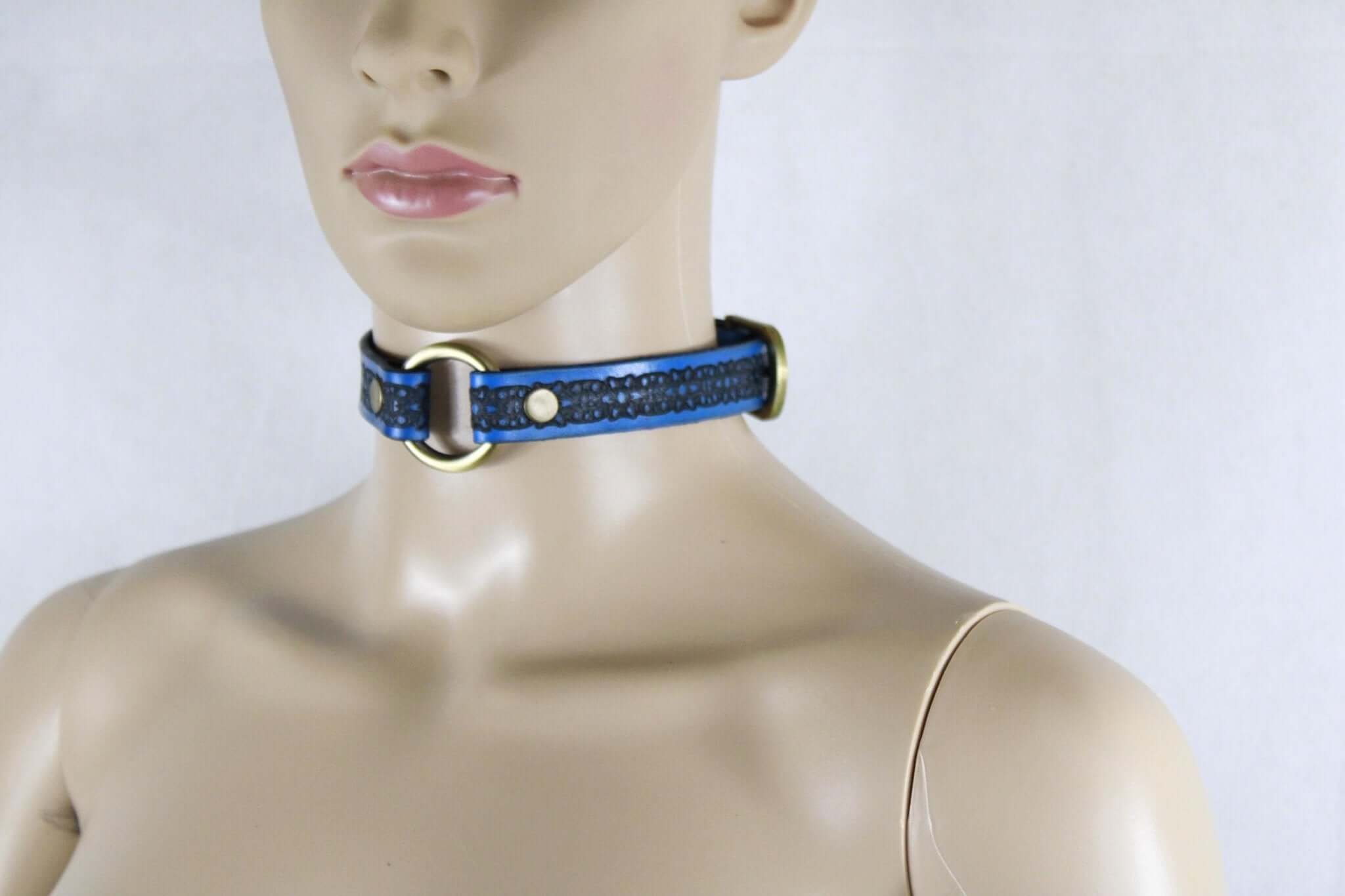 Royal blue submissive collar with embossed floral pattern, perfect for discreet day wear and BDSM fashion.
