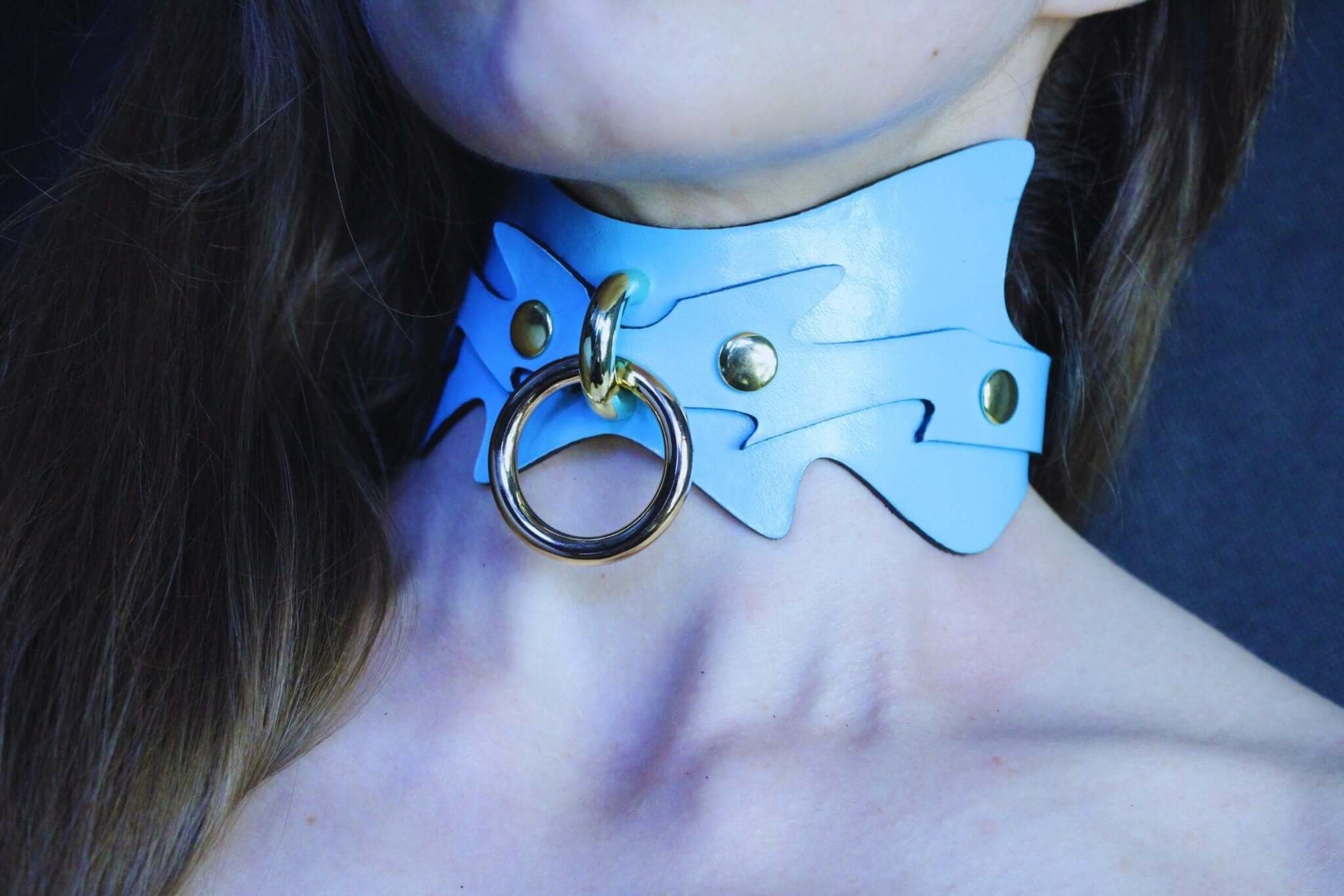 Sky blue spiked leather submissive collar with O-ring, ideal for petplay and BDSM dynamics.