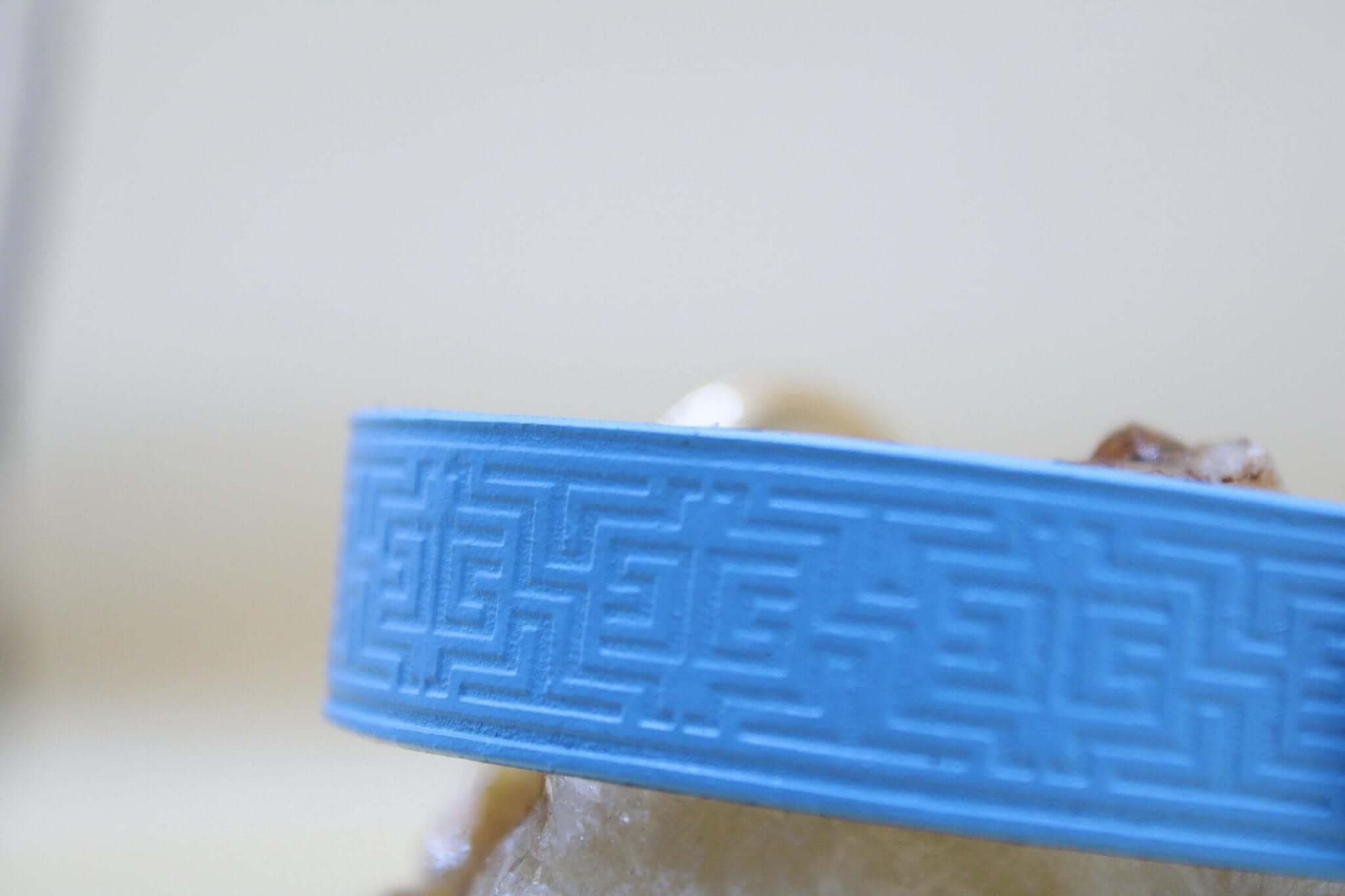 Sky blue leather submissive collar with geometric embossing, perfect for BDSM, bondage jewelry, discreet day wear.