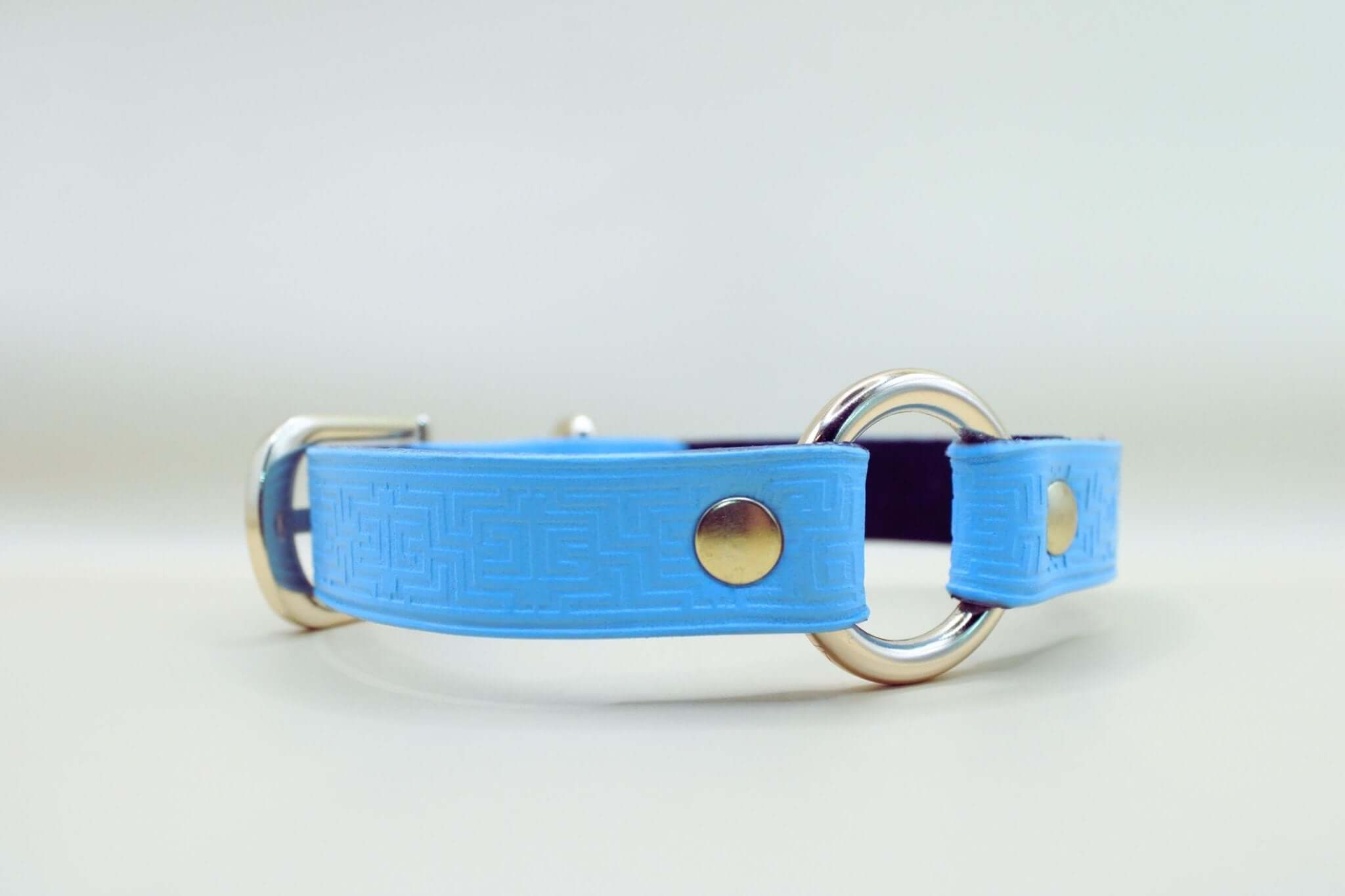 Sky blue leather submissive collar with O-ring, geometric design, perfect for BDSM and discreet day wear.