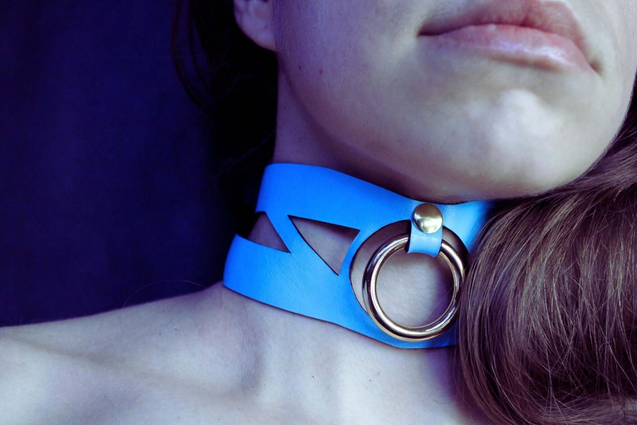 Sky blue cutout leather submissive collar with metal ring, ideal for bdsm and submissive jewelry.
