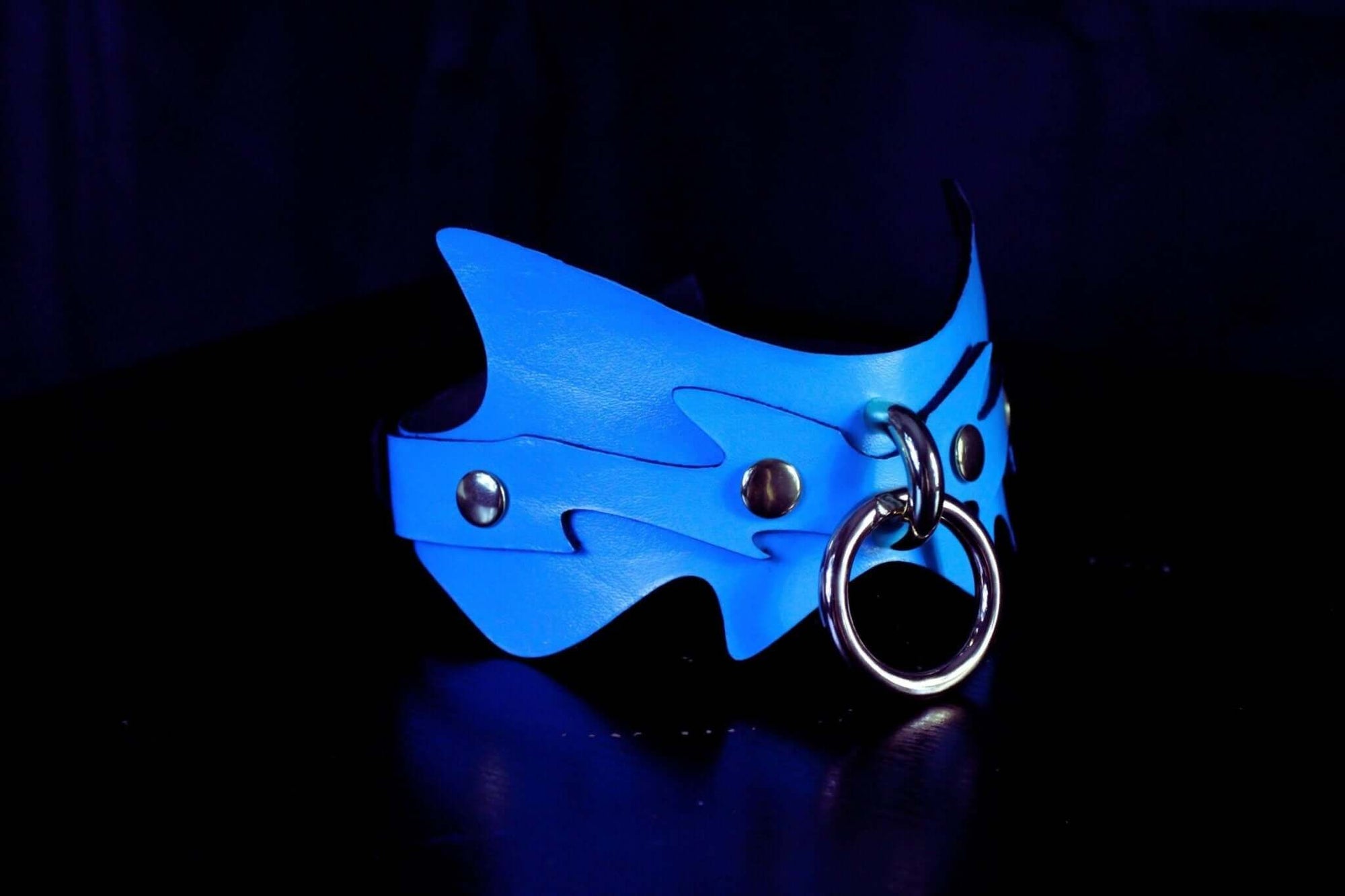 Sky blue spiked leather day collar, perfect for submissive jewelry and BDSM play, featuring unique batwing design and O-ring.