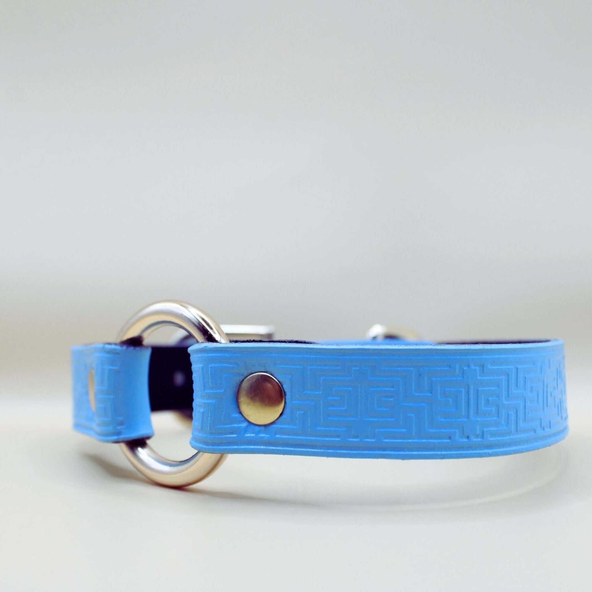 Sky blue leather submissive collar with O-ring, embossed geometric pattern, perfect for BDSM and discreet day wear.