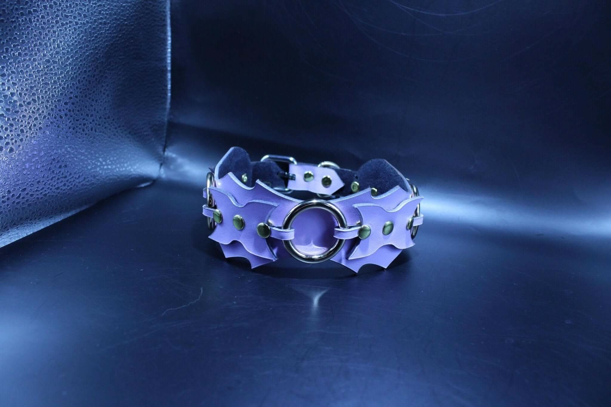 Leather BDSM collar featuring a unique armor-inspired design, perfect for dominant and submissive dynamics in bondage.