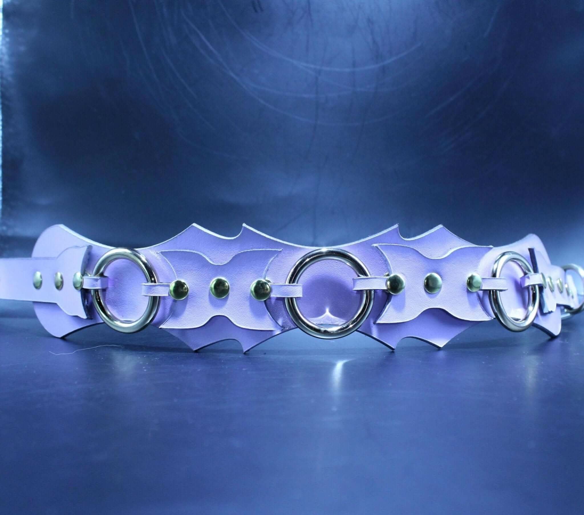 Lavender leather submissive collar with batwing design and O-ring, perfect for BDSM jewelry and bondage gear.