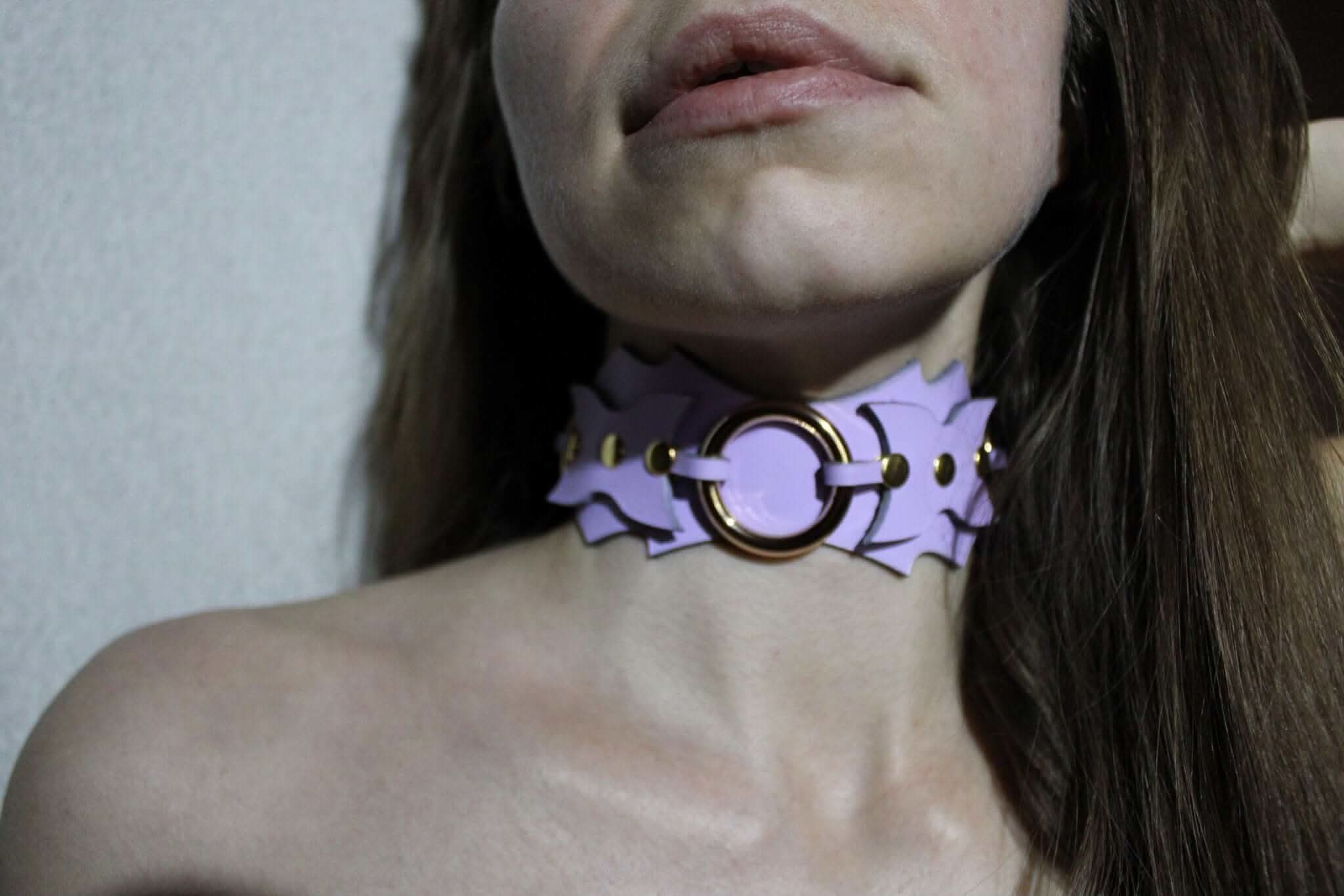 Stylish leather submissive collar with batwing design and O-ring, perfect for BDSM jewelry and self-expression.