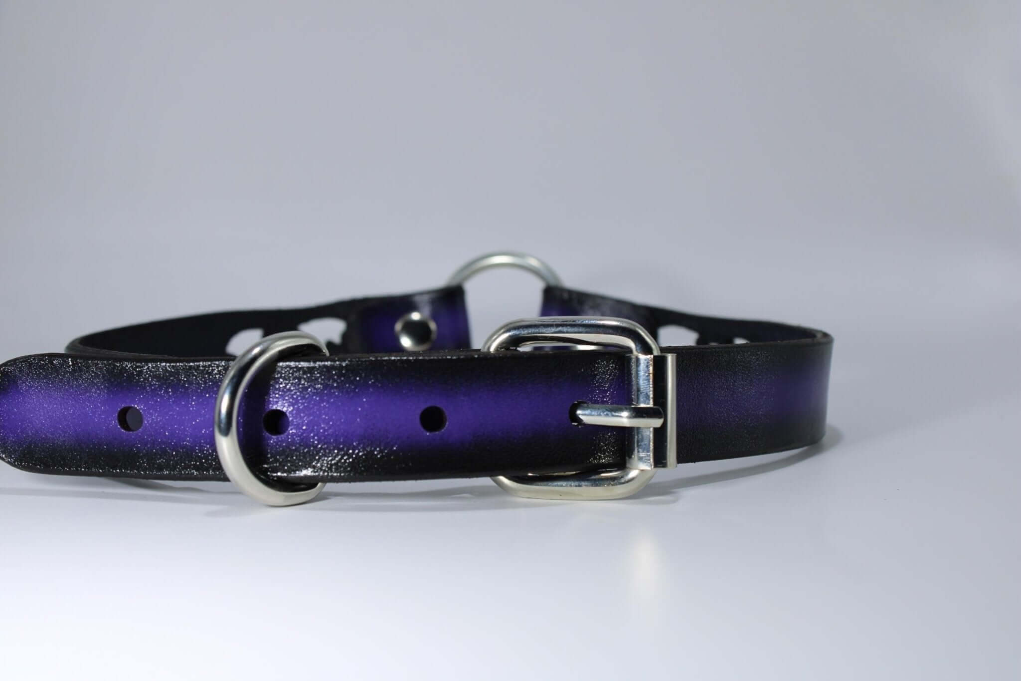 BDSM bat collar featuring a purple leather design with silver O-rings, perfect for gothic fashion and bondage play.