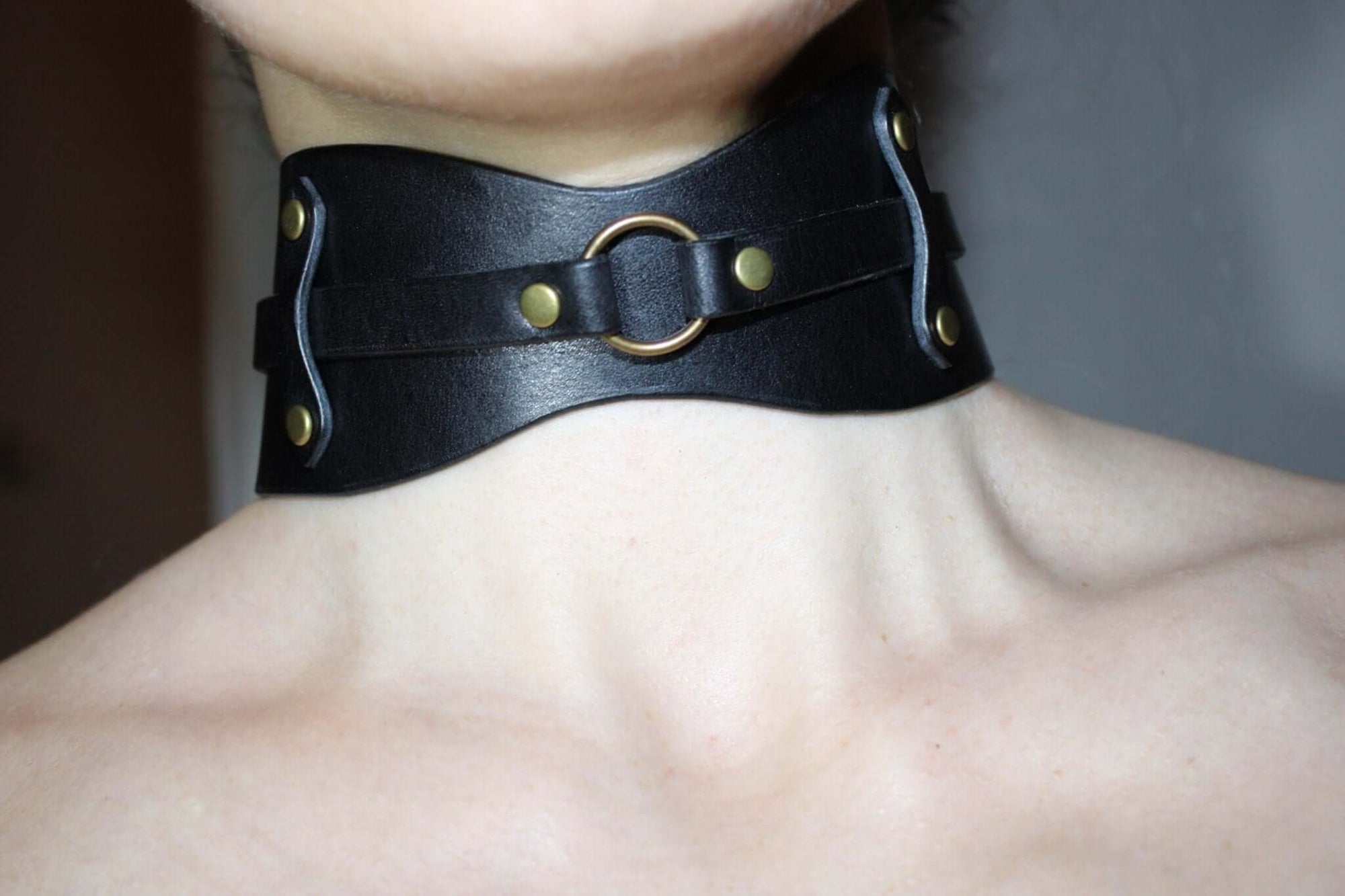 Edgy leather choker collar with O-ring, perfect for BDSM fashion and submissive jewelry, ideal for daring style.