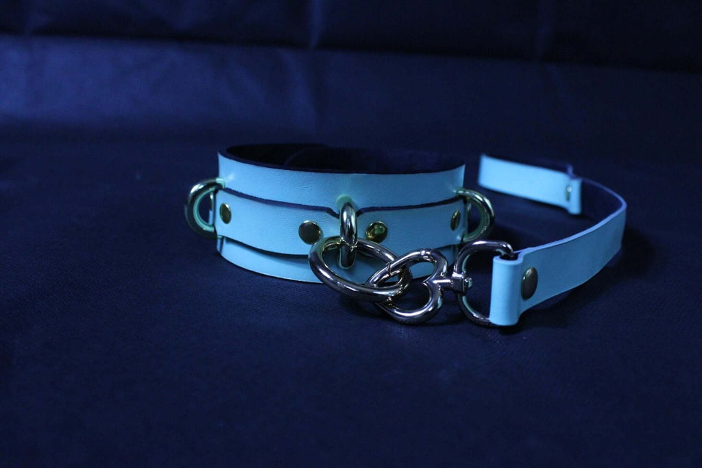 Blue leather submissive collar with metal connectors, ideal for BDSM bondage and erotic play.