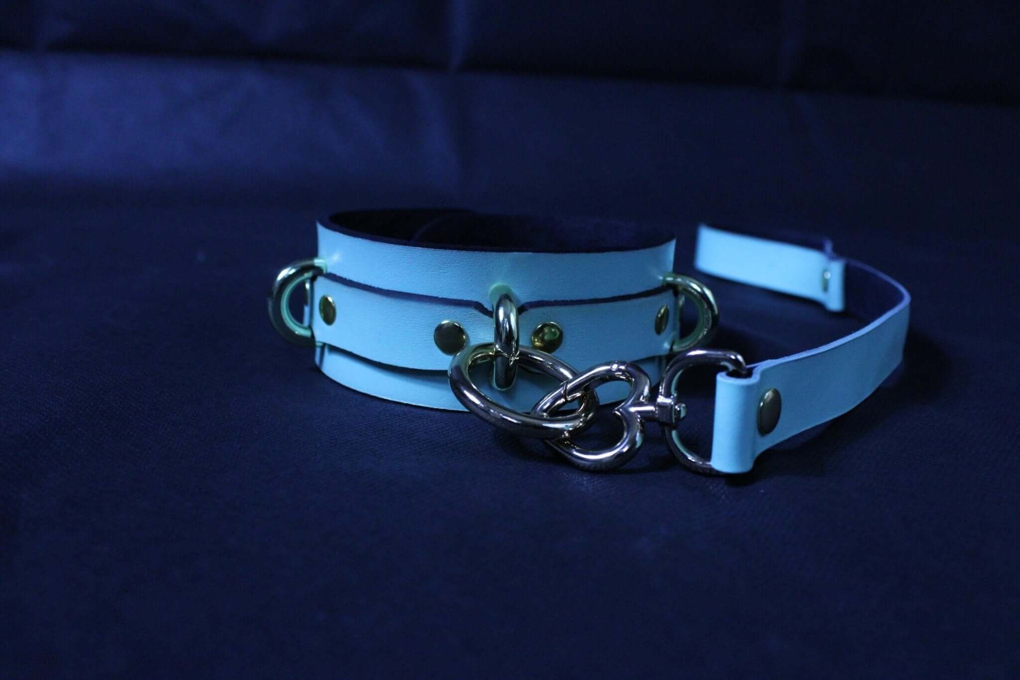 Blue leather submissive collar with metal connectors, ideal for BDSM bondage and erotic play.