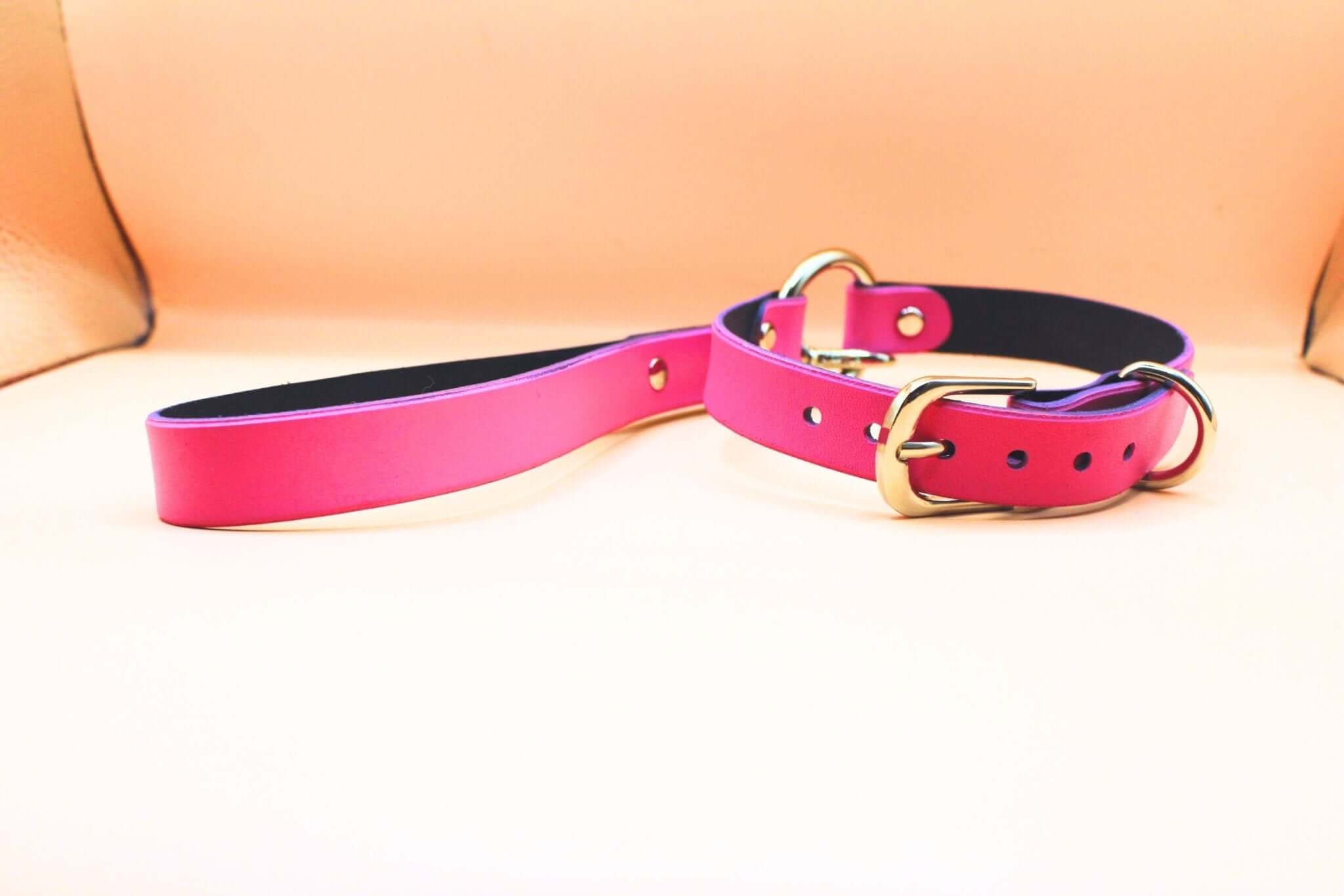 Elegant pink leather submissive collar, perfect for discreet daywear and BDSM fashion.
