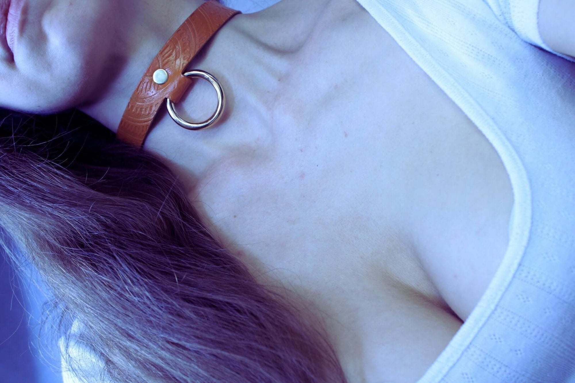 Tan leather BDSM collar with gold ring and pearl, perfect for submissive jewelry and stylish bondage accessories.