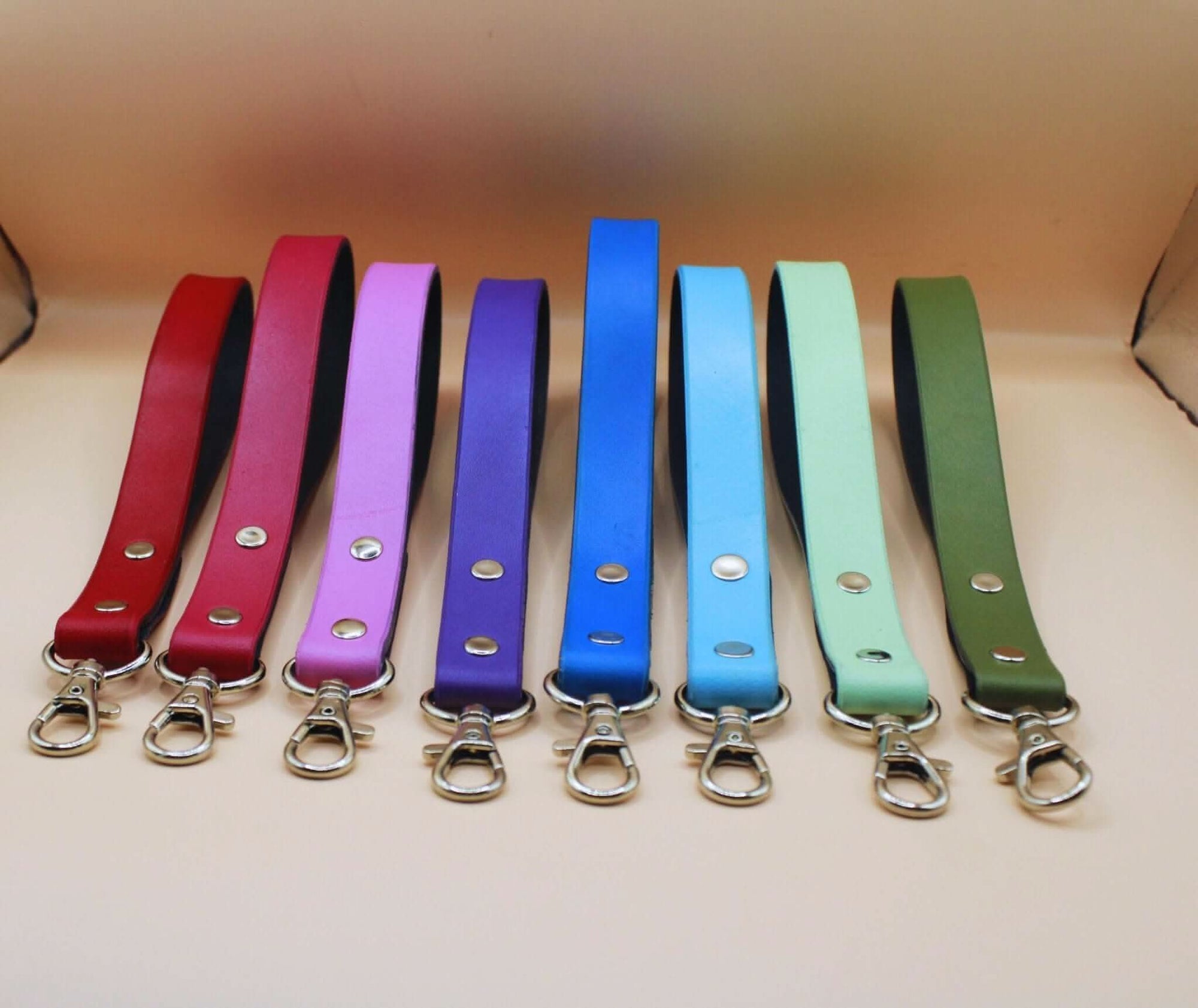 Colorful leather leashes for BDSM play, showcasing various shades for sub collars and bondage gear.
