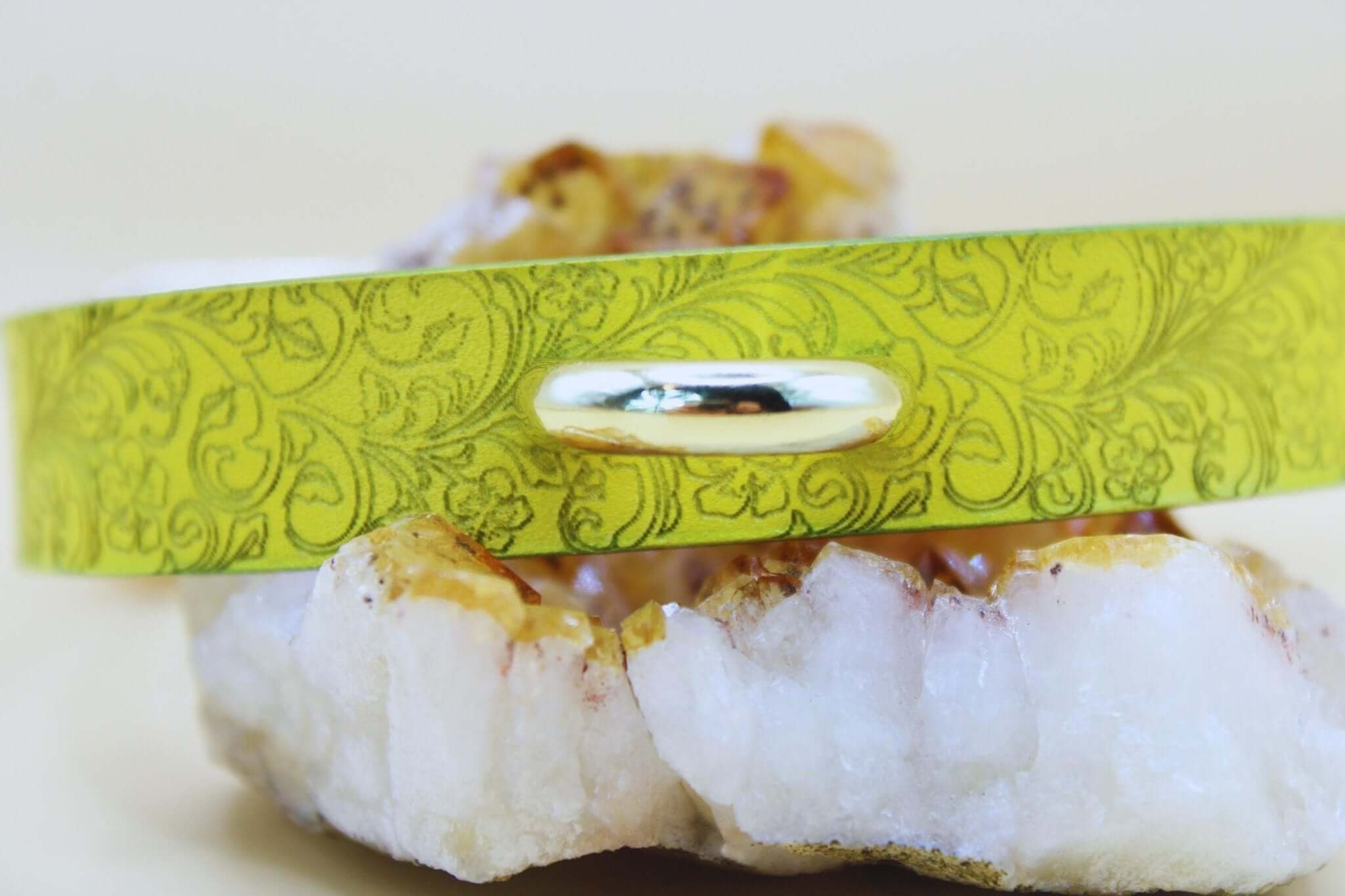 Yellow floral leather BDSM collar on crystal, perfect for submissive jewelry and elegant bondage accessories.