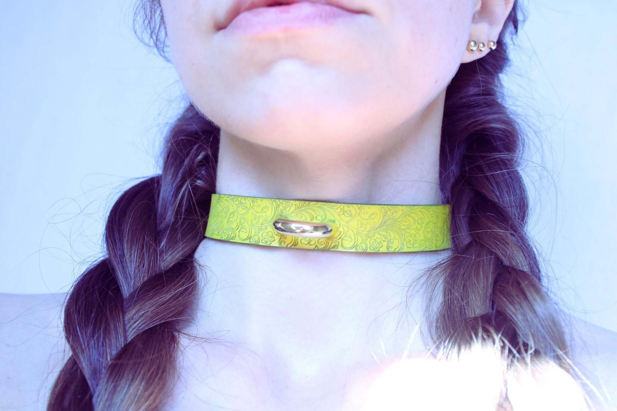 Yellow floral leather BDSM collar showcasing elegance and beauty in submissive jewelry for power dynamics.