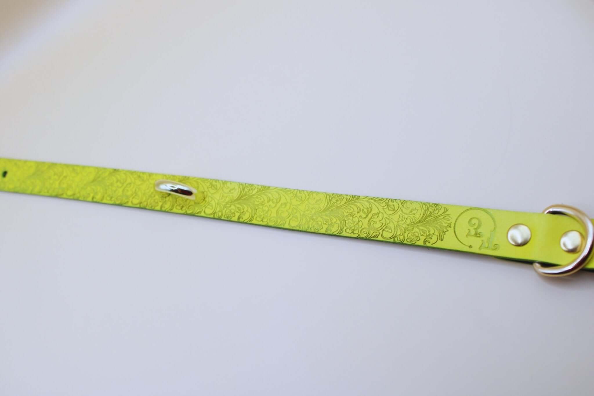 Yellow floral embossed leather submissive collar for BDSM and bondage gear, ideal as a discreet day collar.